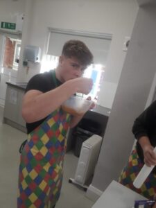 Ambergate pupil eating the food they prepared